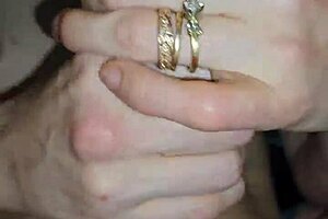 glove-wearing milf slowly milks a throbbing cock