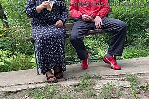 Hot Milf Jerks Off A Big Dick Into A Glass In The Park On A Bench