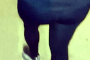 Look at this mature street whore flashing her thong in transparent leggings outdoors.