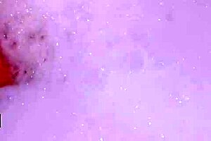 Enchanting brunette muse relaxes in a sensual bath on the sofa