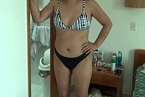 on the beach, wearing a bikini, my stepson films me, and that big bulge fascinates me