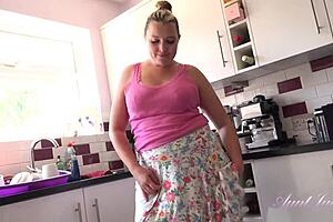 Hot BBW milf Charlie Rae has naughty fun in the kitchen at Auntjudys with big tits.