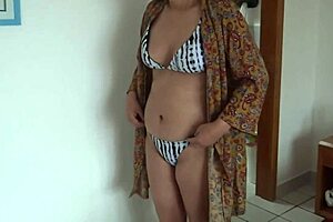 on the beach, wearing a bikini, my stepson films me, and that big bulge fascinates me