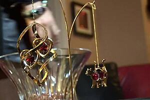 Horny busty milfs engage in lesbian muff diving on the sofa.