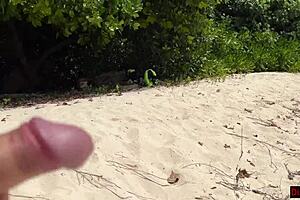 Stepmom and stepdaughter picked up on beach for risky public handjob, ending with cum on face.