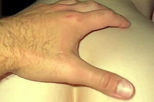 In the bedroom, a milf rides reverse cowgirl, leading to a creampie with her amateur partner