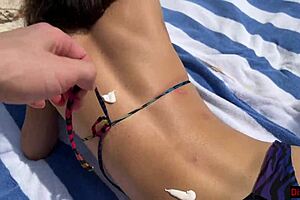 Stepmom and stepdaughter picked up on beach for risky public handjob, ending with cum on face.