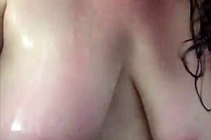 Big boob mama powerfully showers, washes hair, and shaves.