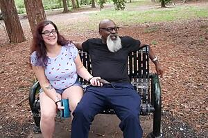 Nerdy milf strokes and sucks big black dick in the park