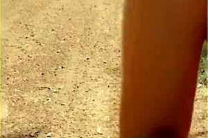 Wifey changes her shirt in the outdoors. She exposes shaved pussy and tits fully.