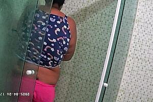 Hidden camera catches neighbor shaving her pussy.