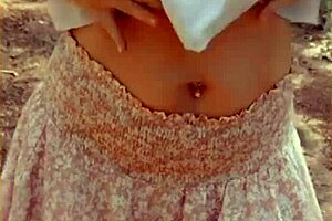 Wifey changes her shirt in the outdoors. She exposes shaved pussy and tits fully.