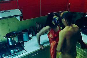 beautiful slender wife in erotic bodysuit in the kitchen