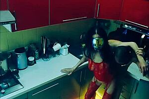 beautiful slender wife in erotic bodysuit in the kitchen