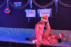 Christmas celebration with a fit milf and Saymon Fitness enjoying the holiday on red.