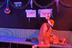 Christmas celebration with a fit milf and Saymon Fitness enjoying the holiday on red.