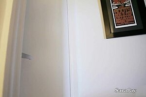 Telephone sex milf Sara Jay fucks her big tits.