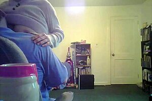 Loris shows titties in the living room setting.