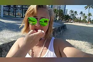 Far out! This sexy African milf flashes big natural tits and pussy lips on the beach.