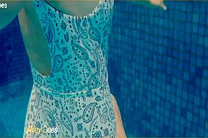 preview - wife swimming in the hotel pool in a hot one piece