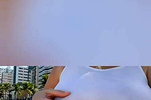 Far out! This sexy African milf flashes big natural tits and pussy lips on the beach.