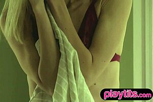 skinny blonde italian milf strips and displays perky small tits