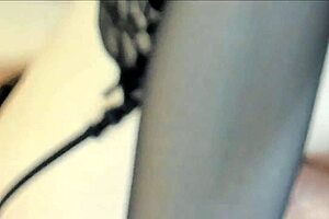 Milf with glasses masturbates using a vibrator