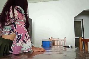 Maintenance man fixes the refrigerator as housewife oddly flashes her vagina on the desk in homemade amateur scene.