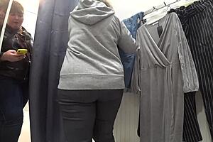a plump milf with juicy ass in white panties and big tits in bra caught on hidden camera in public dressing room