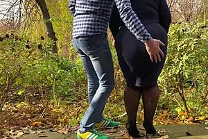 Mother-in-law spreads hairy pussy for outdoor peeing in stockings and heels