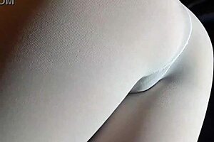 milf with a big firm ass struts in white pantyhose and heels