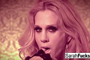 Sexy Sarah Jessie fingers her pussy in leather gloves