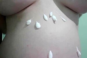 why is this pregnant milf getting cream and massage on her natural tits