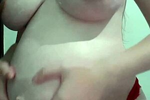 why is this pregnant milf getting cream and massage on her natural tits