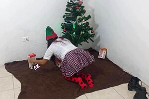 mature student enjoys her christmas gifts with a toy under spotlights in homemade video