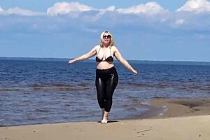 big leather ass blonde milf walks on beach in heels showing natural tits and pussy