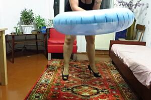 Milf engages in looner fetish by inflating beach circle