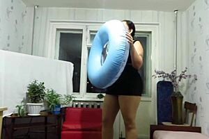 Milf engages in looner fetish by inflating beach circle