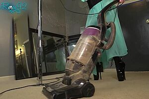 She vacuums the house while strutting in those tight hobble boots as a milf housewife.