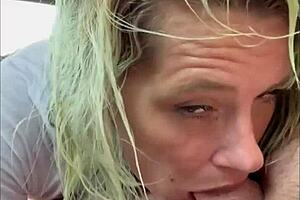 Streetwalker in wet t-shirt gives backseat blowjob and keeps sucking after cum in mouth