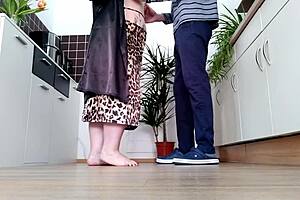 doggystyle in the kitchen with a curvy milf showing natural tits