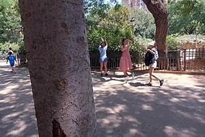 Tourist girl performs blowjob in public park for quality photos exchange.