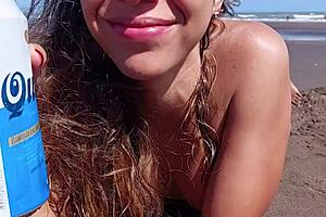 Beach girl removes my condom in the car