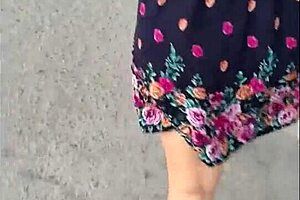 casual upskirt view of puta callejera in skirt on street