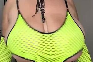 Stepmom shakes huge natural tits on bed touching wet self