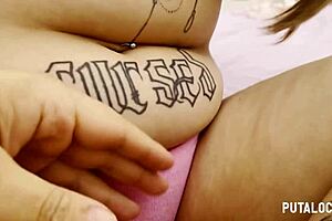 in the video from putalocura a young tattooed woman with fuller figure and prominent chest rides and swallows in an intimate scene