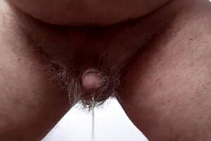 Amateur mature guy with small cock pissing solo for his friends in homemade video