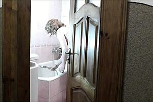 naked sexy blonde woman in bathroom without panties. Pervert man roommate watches outside masturbating cock for cumshot on old young 18+ wet pussy with natural tits.