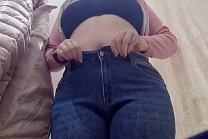 Nicoletta a confident 40-year-old woman enjoys shopping at clothing stores for smaller-than-expected jeans that accentuate her exaggerated curves and appealing figure