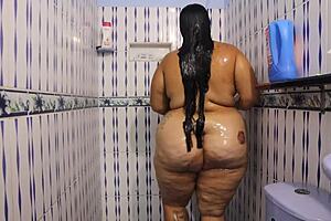 This milf in shower shows huge tits and big ass so hot